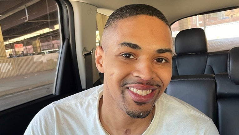 In this image provided by the Maryland Office of the Public Defender, Keith Davis Jr., 31, smiles in a vehicle following his released from prison Friday, Jan 13, 2023, in Baltimore, after prosecutors dropped all charges against him. Davis was tried for the same murder four times and was awaiting a potential fifth trial when newly elected State's Attorney Ivan Bates announced his decision to dismiss the case. (Deborah Katz Levi/Maryland Office of the Public Defender via AP)