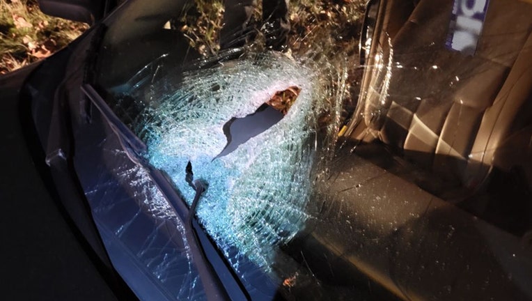 A photo released by the New York State Police shows a damaged windshield.