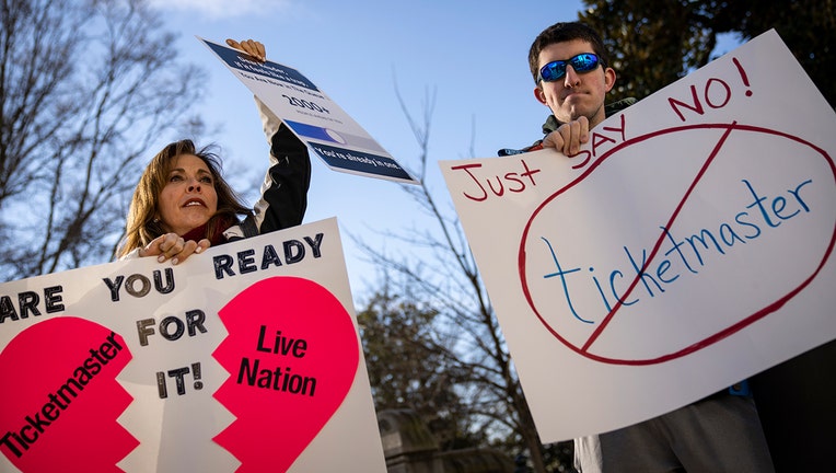 Penny Harrison and her son Parker Harrison rally against the live entertainment ticket industry outside the U.S. Capitol January 24, 2023 in Washington, DC