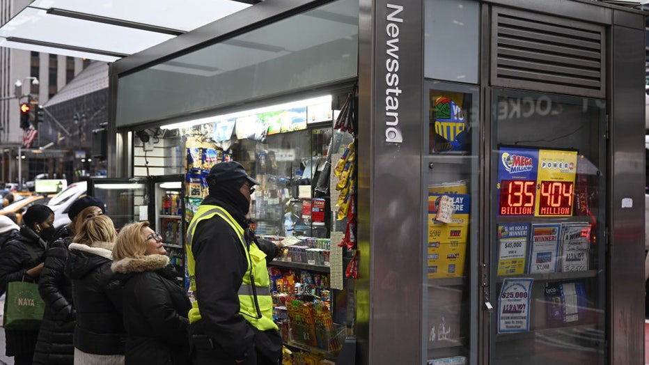 NEW YORK, USA - JANUARY 12: Mega Millions sign and lottery tickets are seen at a store in New York, United States on January 12, 2023. Today's Mega Millions jackpot hits $1.35 billion as its 2nd largest in history. (Photo by Fatih Aktas/Anadolu Agency via Getty Images)