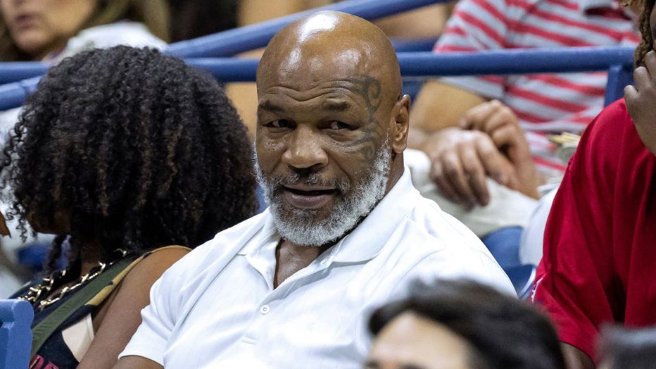 Former US professional bozer Mike Tyson (C) attends the 2022 US Open Tennis tournament men's singles third round match between Russia's Daniil Medvedev and China's Wu Yibing at the USTA Billie Jean King National Tennis Center in New York, on September 2, 2022. (Photo by COREY SIPKIN / AFP) (Photo by COREY SIPKIN/AFP via Getty Images)