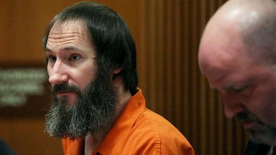 FILE - Johnny Bobbitt stands in the courtroom during his sentencing hearing at Burlington County Superior Court in Mount Holly, N.J., on April 12, 2019. Bobbitt, who pleaded guilty to conspiring with a New Jersey couple on a bogus feel-good story of helping a motorist in distress that garnered more than $400,000 in online donations, has been sentenced to three years' probation. (Tim Tai/The Philadelphia Inquirer via AP, Pool, File)