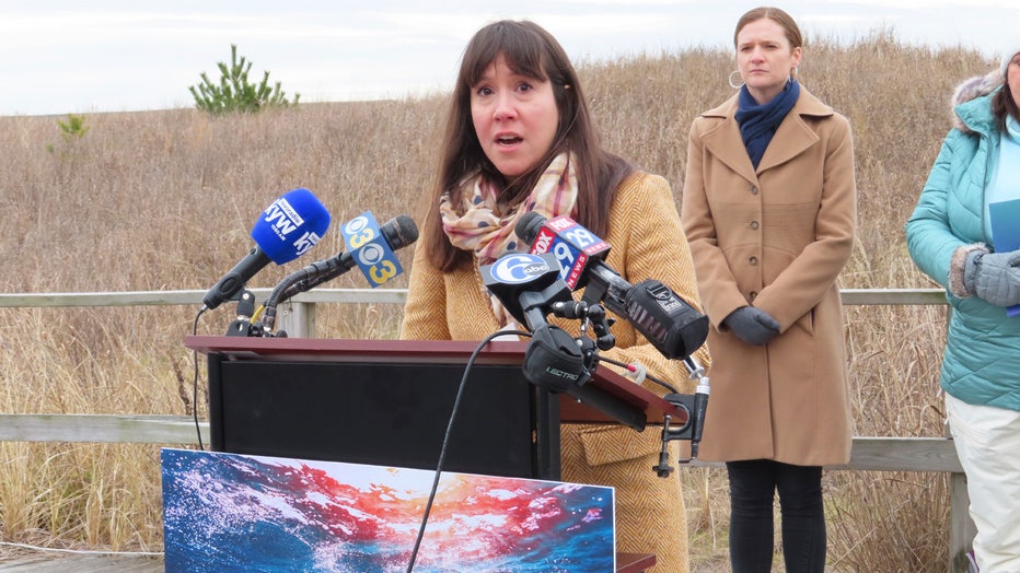 Anjuli Ramos-Busot, director of the New Jersey Sierra Club chapter, speaks at a press conference in Atlantic City, N.J. on Tuesday, Jan. 17, 2023, at which environmental groups supported offshore wind power development and decried what they call the false narrative that offshore wind site preparation work is responsible for seven whale deaths in New Jersey and New York in little over a month. (AP Photo/Wayne Parry)