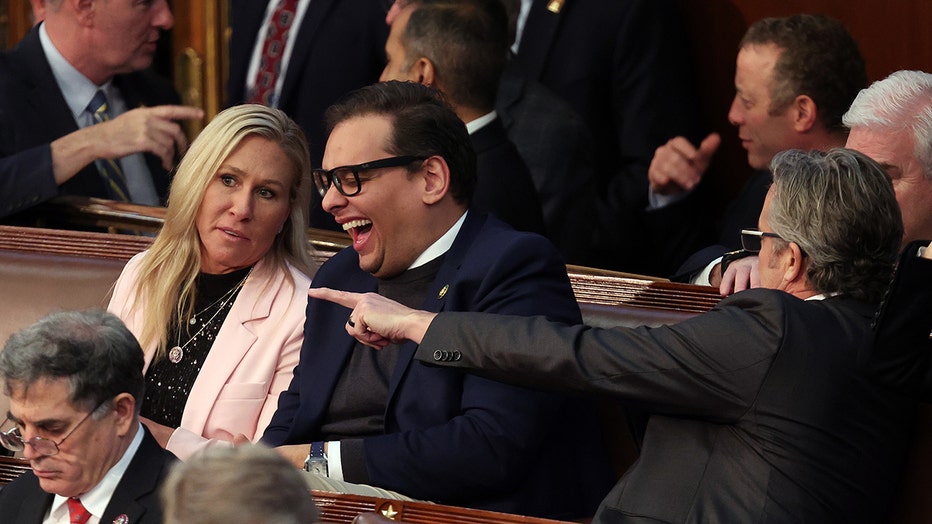 U.S. Rep. Marjorie Taylor Greene (R-GA) (L) talks to Rep.-elect George Santos (R-NY) in the House Chamber during the third day of elections for Speaker of the House at the U.S. Capitol Building on January 05, 2023 in Washington, DC. (Photo by Win McNamee/Getty Images)