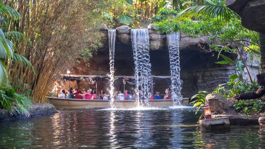 Anaheim, CA - July 09: Riders pass through the backside of water at Schweitzer Falls during the Jungle Cruise ride at Adventureland, Disneyland in Anaheim, CA, on Friday, July 9, 2021. The official reopening of Jungle Cruise will be on July 16, 2021, with new adventures, an expanded storyline and more humor as skippers take guests on a tongue-in-cheek journey along some of the most remote rivers around the world at Disneyland. Whats new: The expanded backstory centers around Alberta Falls, the granddaughter of the world-renowned Dr. Albert Falls, who is now proprietor of the Jungle Navigation Company Ltd. New scenes include: A safari of explorers from around the world finds itself up a tree after the journey goes awry. Chimpanzees have taken over the expeditions wrecked boat. A Lost & Found location has turned into a Gift Shop run by Albertas longtime friend, Trader Sam. (Allen J. Schaben / Los Angeles Times via Getty Images)