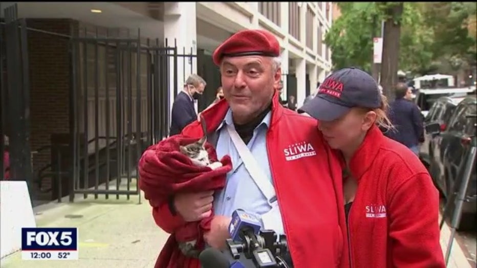Curtis Sliwa speaks to reporters outside a Manhattan voting site on Election Day 2021.