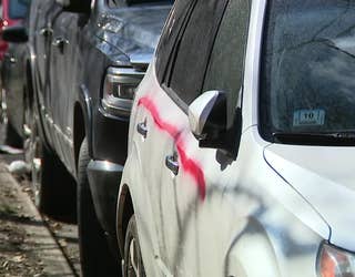 White vehicles spray painted pink in West Side neighborhood