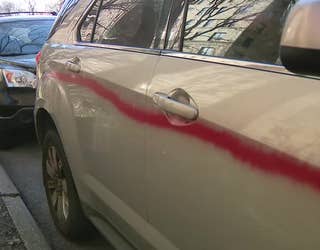 White vehicles spray painted pink in West Side neighborhood