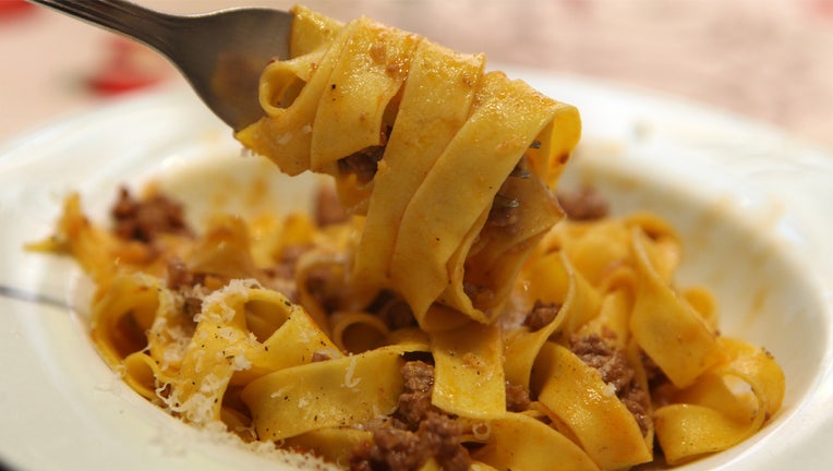 BOLOGNA, ITALY - MARCH 30: Hand-made fettuccine is served with Bologna's iconic "ragu" meat sauce after a cooking lesson at Il Salotto di Penelope on March 30, 2017 in Bologna, Italy. Il Salotto di Penelope (Penelope's Lounge) is a private cooking school where Italian gourmet cooks Barbara Zaccagni and Valeria Hensemberger offer classes in preparing traditional Italian cuisine alongside their insights on Emilia Romagna culture and gastronomy. At the end of the lesson, participants get to eat what they prepared, served with a bottle of classic local wine. (Photo by David Silverman/Getty Images)