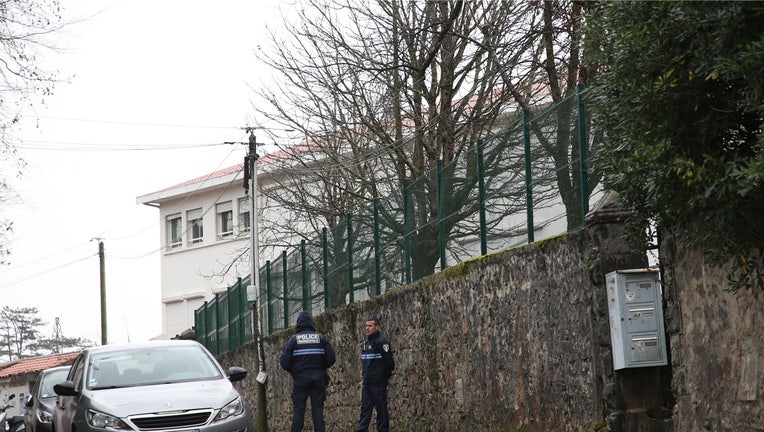 Police officers guard an access to a private Catholic school after a teacher of Spanish has been stabbed to death by a high school student, Wednesday, Feb. 22, 2023 in Saint-Jean-de-Luz, southwestern France. The student has been arrested by police, the prosecutor of Bayonne said. (AP Photo/Bob Edme)
