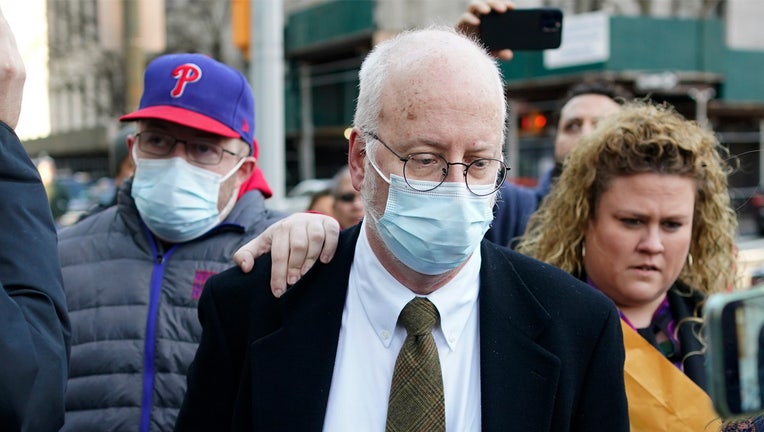 FILE - Robert Hadden, center, leaves the federal courthouse in New York, Tuesday, Jan. 24, 2023. A federal judge in New York City ruled Wednesday, Feb. 1, that Hadden, an ex-gynecologist convicted of sexually abusing hundreds of patients, was ordered to spend the next two months in jail as he awaits sentencing. (AP Photo/Seth Wenig, File)