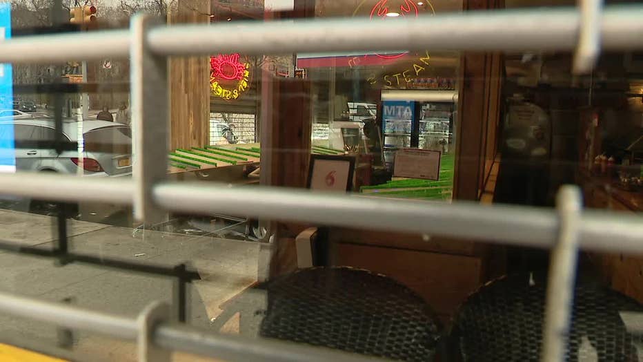 The inside of the Fish Express Fish Market is seen through a window.