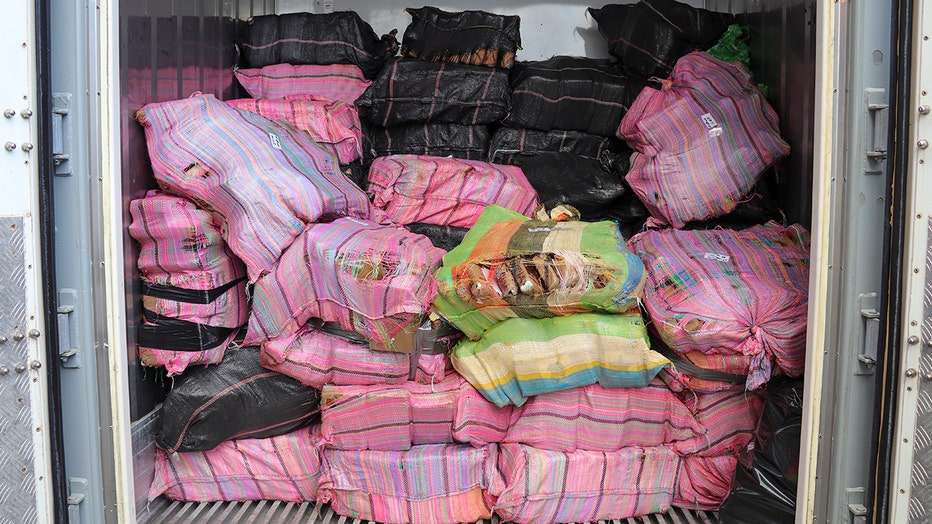 In this photo supplied by the New Zealand police, a shipment of cocaine found floating on the surface of the Pacific Ocean sits stacked in a container in Auckland, New Zealand, Tuesday, Feb. 7, 2023. New Zealand police said Wednesday they found more than 3 tons of cocaine floating in a remote part of the Pacific Ocean after it was dropped there by an international drug-smuggling syndicate. (NZ Police via AP)