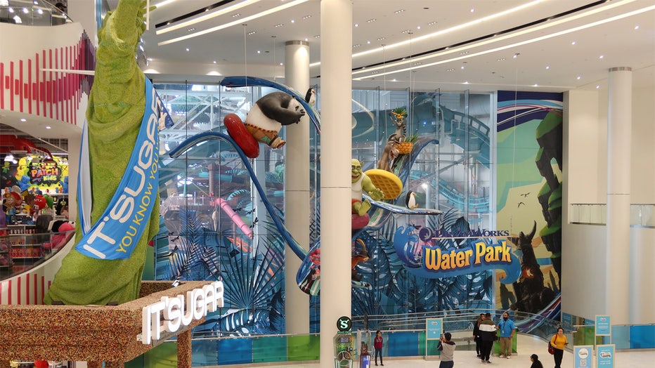 EAST RUTHERFORD, NJ - OCTOBER 29: People walk past the Dreamworks Water Park attraction at the American Dream, retail and entertainment complex on October 29, 2022, in East Rutherford, New Jersey. (Photo by Gary Hershorn/Getty Images)