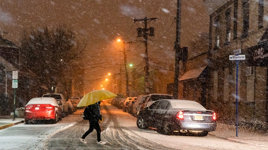 WEST NEW YORK, NEW JERSEY - FEBRUARY 27: A man covers himself of snow during a winter storm around Times Square on February 27, 2023 in Hoboken, New Jersey. The National Weather Service announced between 2 to 5 inches of snow to fall Monday night into Tuesday morning while other parts of the tri-state area, including northern New Jersey, could see more than a half-foot of accumulation associated with this storm. (Photo by Eduardo MunozAlvarez/VIEWpress)