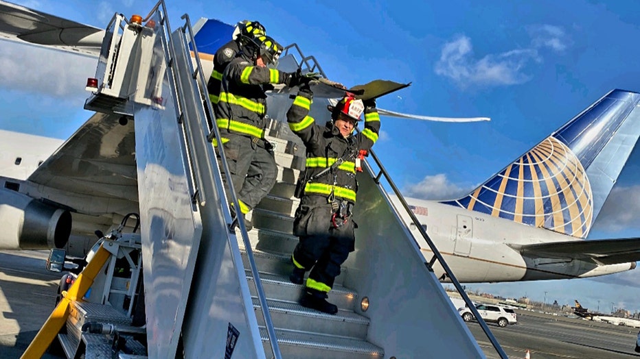 Port Authority Fire Department personnel eventually removed and took away part of the damaged wing.