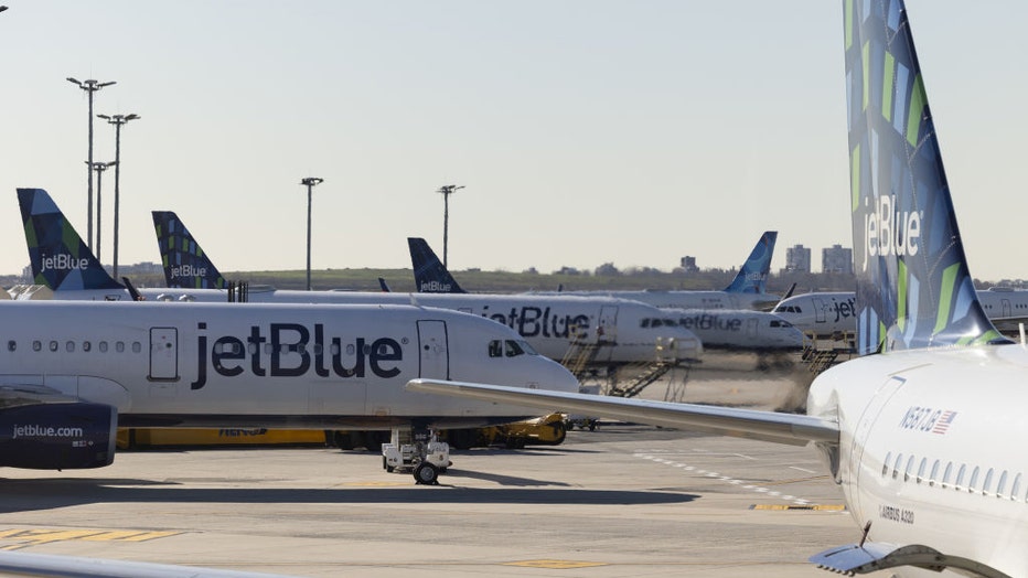 FILE - JetBlue planes at John F. Kennedy International Airport (JFK) in New York, U.S., on Nov. 24, 2021. Photographer: Angus Mordant/Bloomberg via Getty Images