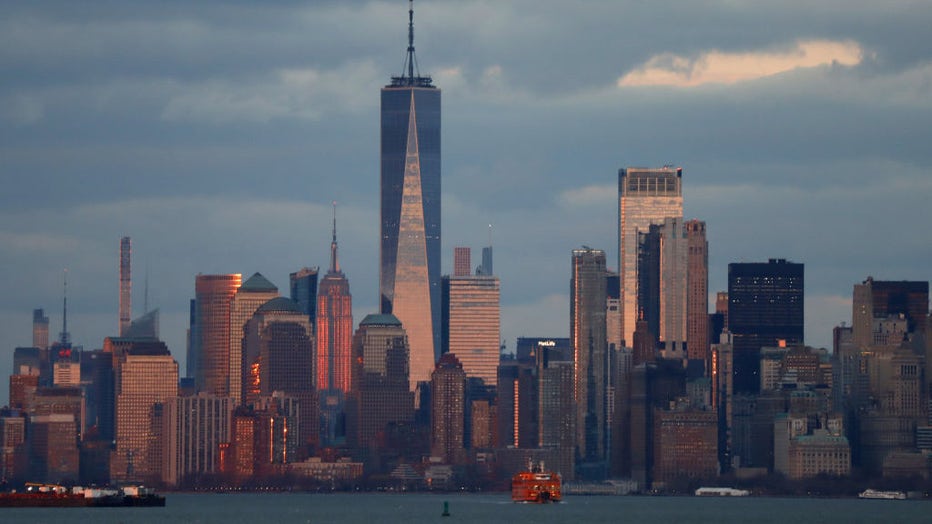 FILE - The sun illuminates the Empire State Building behind the skyline of lower Manhattan and One World Trade Center on March 5, 2023, in New York City. (Photo by Gary Hershorn/Getty Images)
