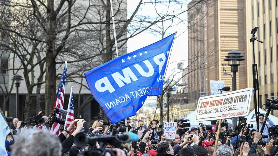 Supporters, opponents of Donald Trump wait in front of courthouse in New York