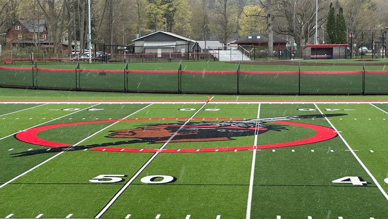 The logo of the Salamanca City Central School District is seen on the football field turf in Salamanca, N.Y., on April 18, 2023. The school district, located on Seneca Nation of Indians territory, may have to replace its logo after New York passed a ban on the use of Indigenous names, mascots and logos by public schools. (AP Photo/Carolyn Thompson)