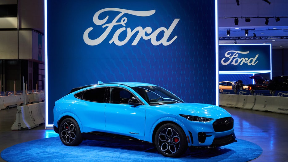 The 2022 Ford Mustang Mach-E electric sports utility vehicle (SUV) at AutoMobility LA ahead of the Los Angeles Auto Show in Los Angeles, California, U.S., on Wednesday, Nov. 17, 2021. Covid-19 canceled the Los Angeles Auto Show in 2020 and now that the show is back, some automakers have decided they didn't need it anyway. Photographer: Bing Guan/Bloomberg via Getty Images