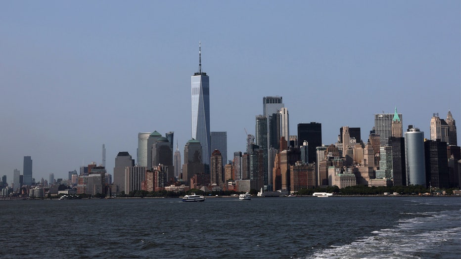 NEW YORK, NEW YORK - MAY 23: The Manhattan skyline is seen from the Staten Island Ferry on May 23, 2023 in New York City. In the new study published in the journal Earth’s Future, new research has found that New York City may be sinking due to the weight of it numerous skyscrapers. The sinking is thought to be exacerbated by the waters that flank the city, as sea levels have risen by about 9in, or 22cm, since 1950 and are believed to be a result of climate crisis. (Photo by Spencer Platt/Getty Images)