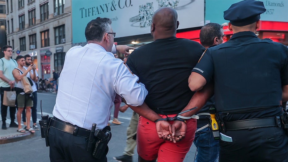 NEW YORK, UNITED STATES - MAY 08: Protesters are taken into custody by the police during the vigil to honor the life of a 30-year-old homeless African-American man Jordan Neely who was killed after being held in a chokehold by a 24-year-old Marine veteran on a subway in New York, United States on May 08, 2023. Multiple people, including a female journalist were arrested during a vigil to honor the life of Jordan Neely. (Photo by Selcuk Acar/Anadolu Agency via Getty Images)