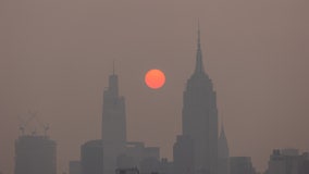 Photos: Wildfire smoke turns sun to reddish orb over Northeast