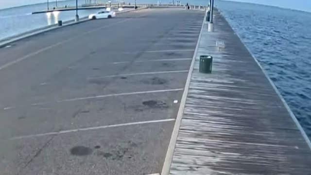 Officer, firefighter rescue man after driving car into bay in Suffolk County