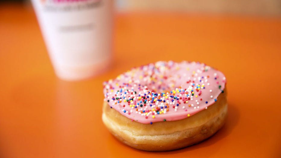 FILE - A strawberry frosted donut with sprinkles is arranged for a photograph at a Dunkin Donuts Inc. location in Los Angeles, California, on Sept. 6, 2017. Photographer: Patrick T. Fallon/Bloomberg via Getty Images