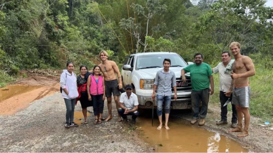 Daniel Penny in South America with a group of locals who helped him after his car broke down. (Courtesy of Daniel Penny)