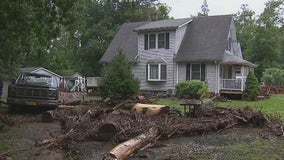 Residents assess damage after flood waters sweep through Orange County