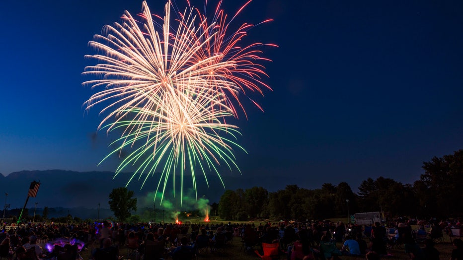 A large crowd watching fireworks in Indiana. (Photo by Jeremy Hogan/SOPA Images/LightRocket via Getty Images)