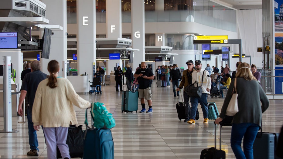 Travelers at LaGuardia Airport (LGA) in the Queens borough of New York, US, on Thursday, June 8, 2023. The Federal Aviation Administration said LaGuardia Airport flights have now been placed under a ground delay program after being grounded due to poor visibility. Photographer: Michael Nagle/Bloomberg via Getty Images