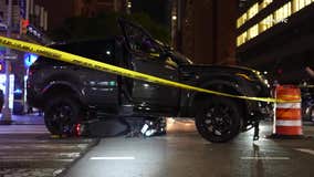 Stolen SUV crash in Hell's Kitchen pins moped delivery driver under car