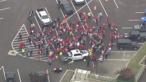 Why do UAW members wear red?