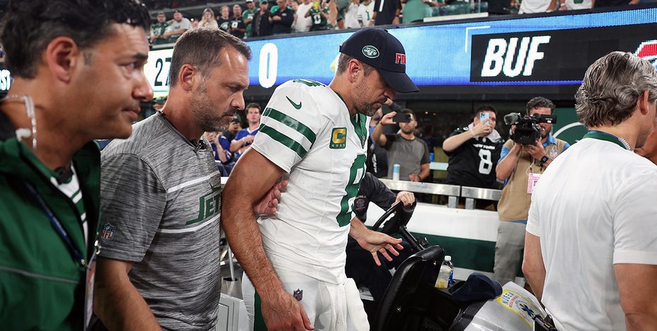 Aaron Rodgers carted from sideline after suffering apparent leg injury in  his first series for Jets