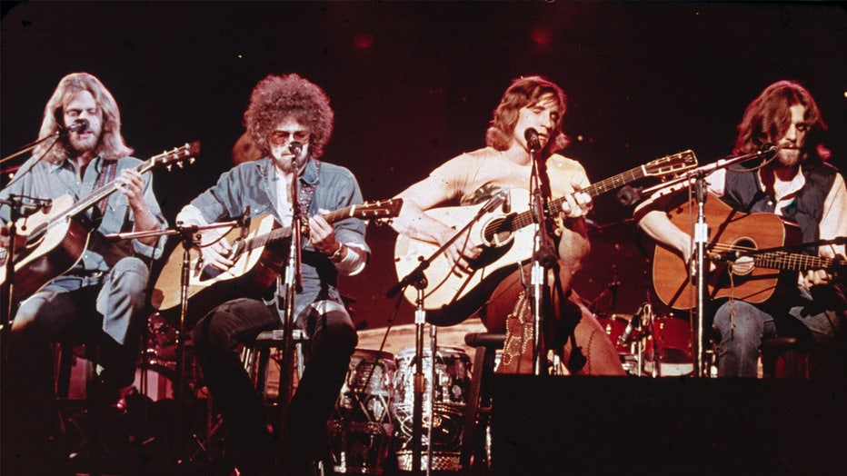 Members of the American soft-rock ensemble The Eagles sit on chairs as the perform on the television show 'Don Kirschner's Rock Concert,' 1979. Bandmembers are (left to right) Glenn Frey, Don Henley, Joe Walsh, and Don Felder. (Photo by Fotos International/Getty Images)