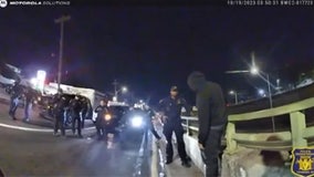 Police dash to save man dangling from overpass in dramatic bodycam footage