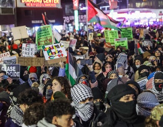 NEW YORK, UNITED STATES - NOVEMBER 29: Pro-Palestinian Americans in New York City gather in front of the News Corp. to protest annual Christmas tree lighting ceremony at Rockefeller Center in New York, United Stated on November 29, 2023. New York Police did not allow protesters to enter the ceremony area. (Photo by Selcuk Acar/Anadolu via Getty Images)