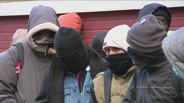 NYC asylum seekers brave frigid conditions to renew shelter applications