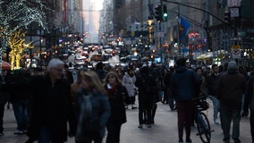 Die-hard Christmas shoppers brave December rainstorms on Fifth Avenue