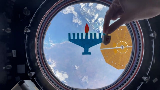 Astronaut celebrates Hanukkah from International Space Station with zero-gravity dreidel