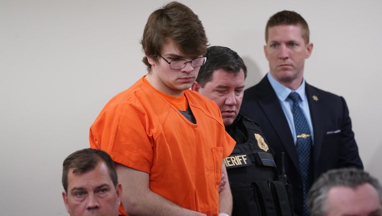 Payton Gendron (C) is escorted back into the courtroom by deputies after a disruption during sentencing in Buffalo, New York State, the United States, on Feb. 15, 2023. The 19-year-old man Payton Gendron, who committed the mass shooting last May in Buffalo of the U.S. state of New York, was sentenced to life in prison without parole on Wednesday as expected while white supremacy got bashed at court. (Derek Gee/Buffalo News/Pool via Xinhua)