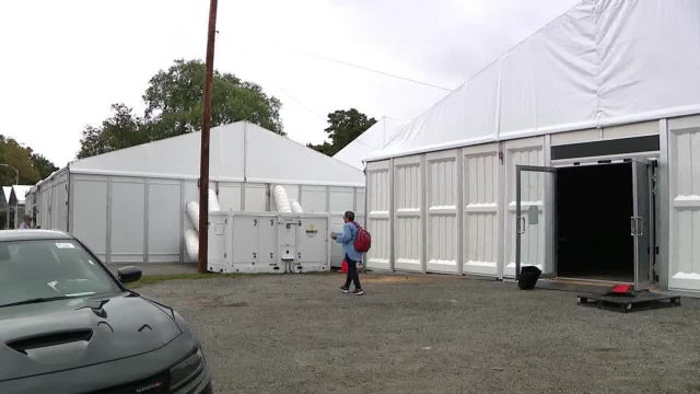 NYC migrant shelter housing single men could add more, despite local resident protests