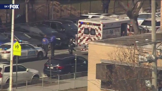 Man shot by police in Queens after pointing gun at cop's head