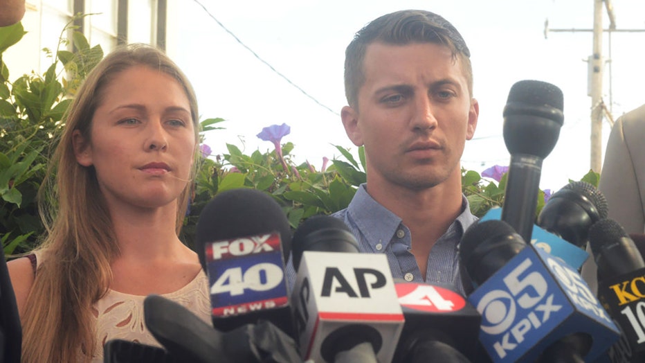 Denise Huskins and Aaron Quinn stand in silence during a press conference on July 13, 2015. (Photo by Chris Riley/MediaNews Group/Vallejo Times Herald via Getty Images)