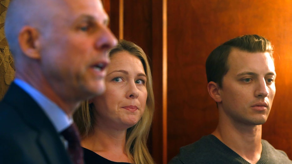 Denise Huskins and Aaron Quinn appear at a news conference with attorney Doug Rappaport (left) in San Francisco, Calif. on Sept. 29, 2016. (Photo By Paul Chinn/The San Francisco Chronicle via Getty Images)