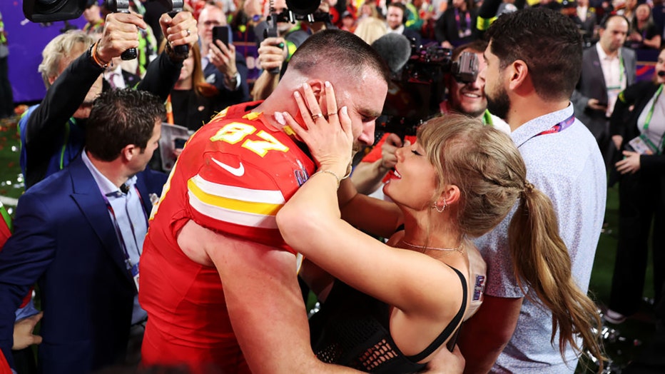 Travis Kelce #87 of the Kansas City Chiefs and Taylor Swift embrace after defeating the San Francisco 49ers in overtime during Super Bowl LVIII at Allegiant Stadium on February 11, 2024 in Las Vegas, Nevada. (Photo by Ezra Shaw/Getty Images)
