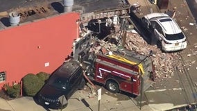 Fire truck slams into Long Island building, causing collapse